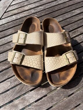 Birkenstock Arizona Two-Strap Sandals in Eggshell Python with Gold Buckles 38